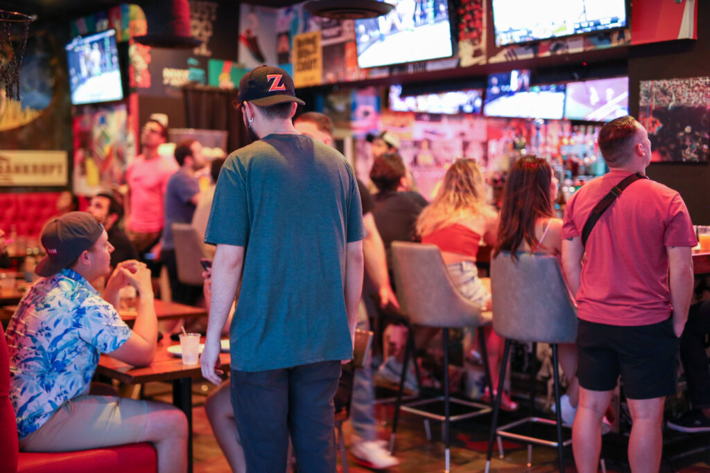 Guests watching UFC fights inside Grails bar with over 70 tvs and full audio